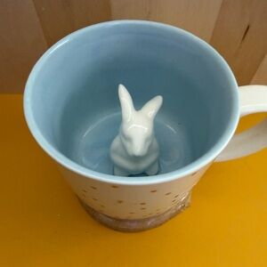 White and Blue Ceramic Mug with Animal Figurine